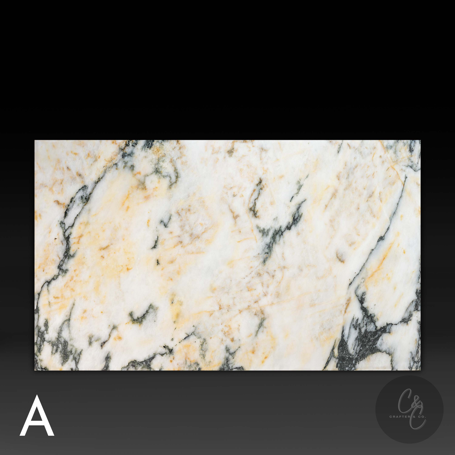 Close-up top viewof natural Calacatta Monet marble with white, gold and grey veining.(Variation A)