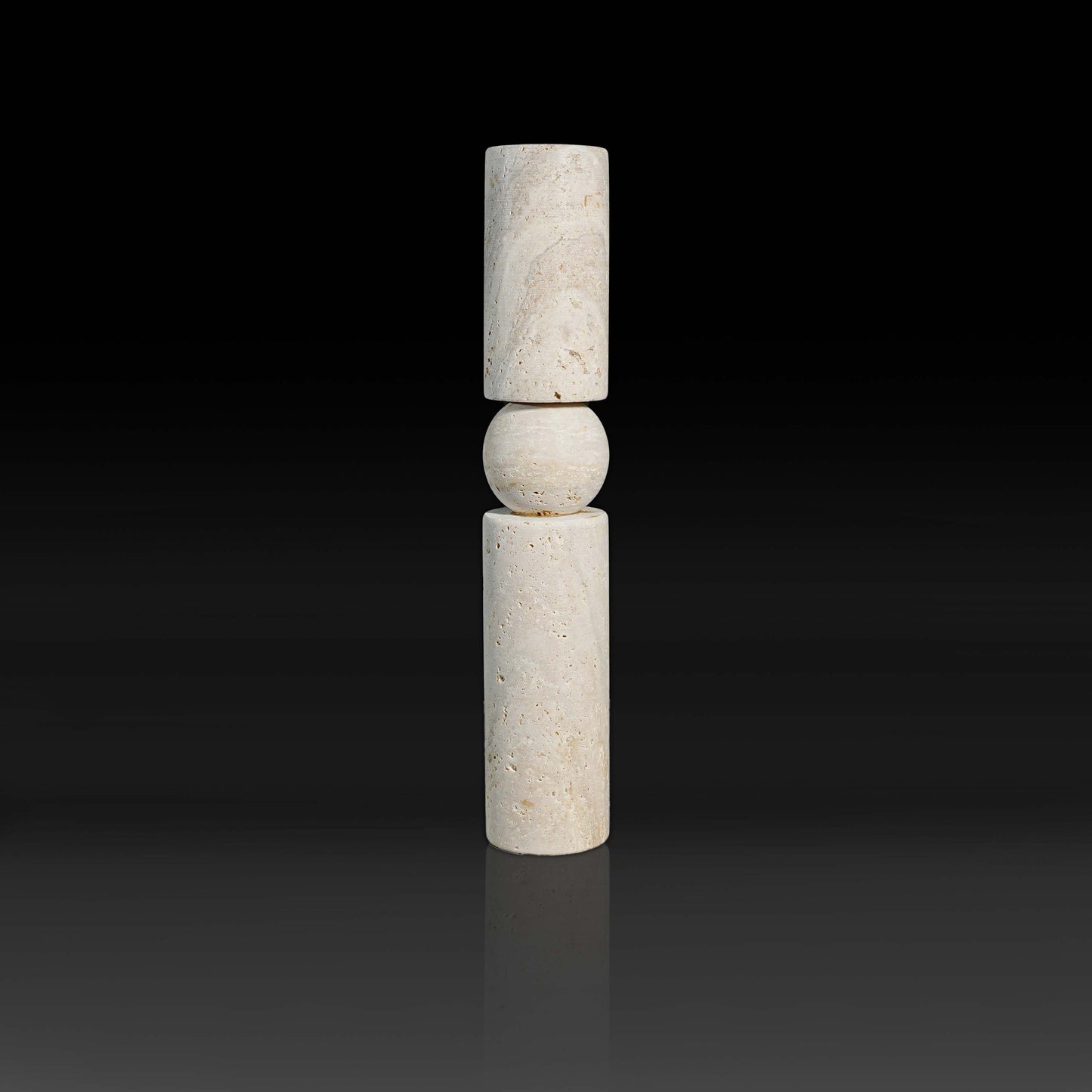 Studio view of Solis Travertine natural stone candle holder with warm textured travertine finish.
