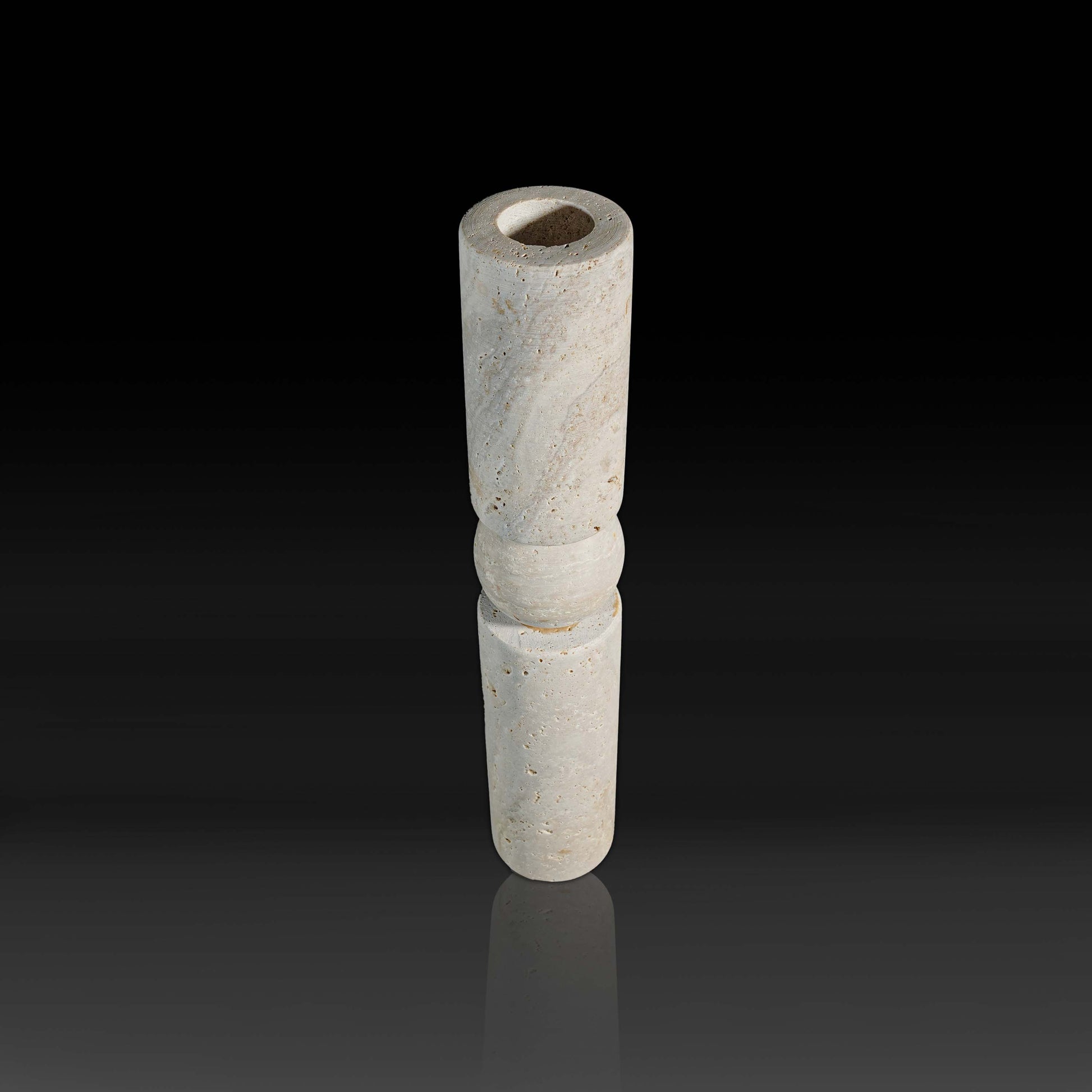 Top angle view of Solis Travertine natural stone candle holder highlighting the candle opening and natural stone texture.