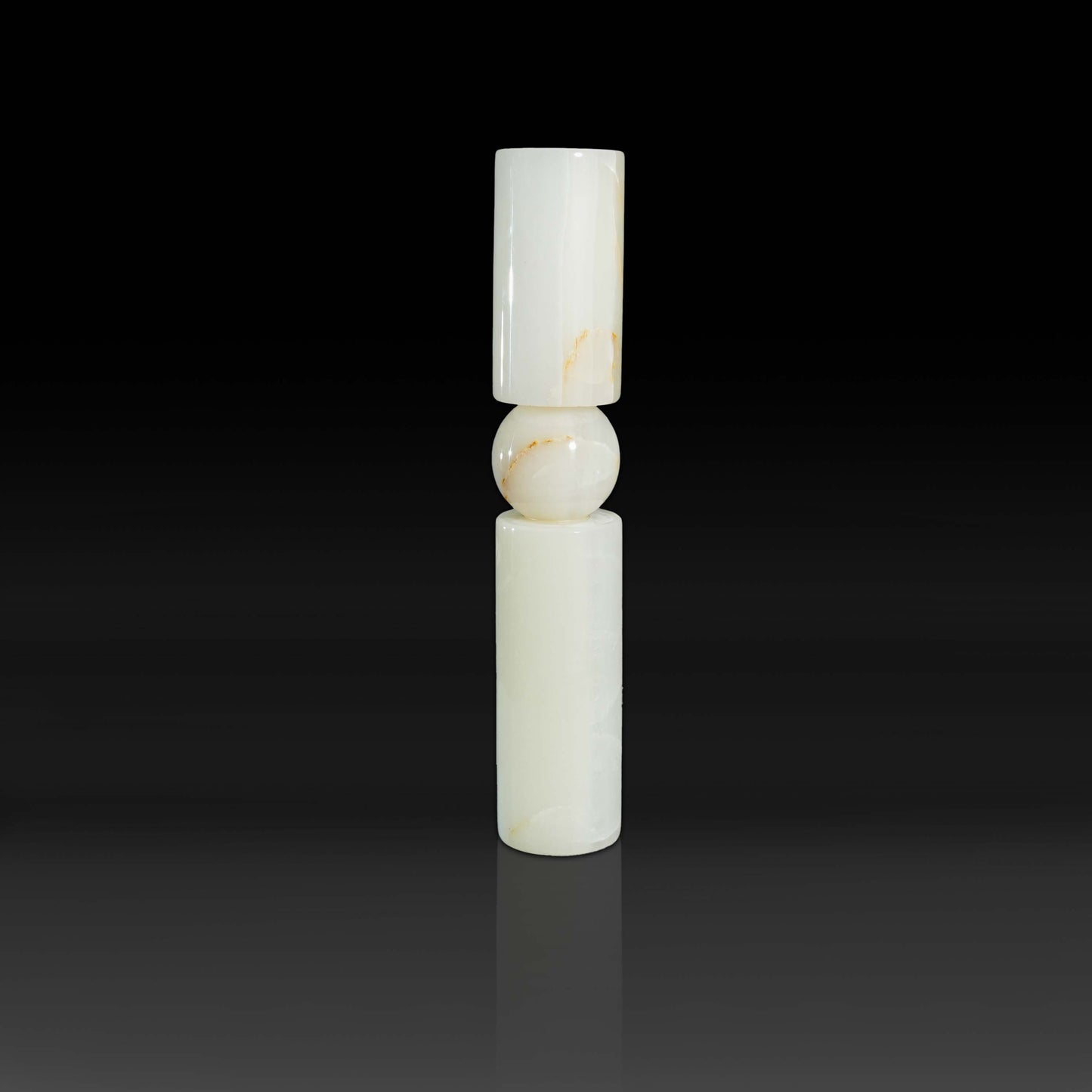 Studio view of Solis White Onyx natural stone candle holder with sculptural modern design.