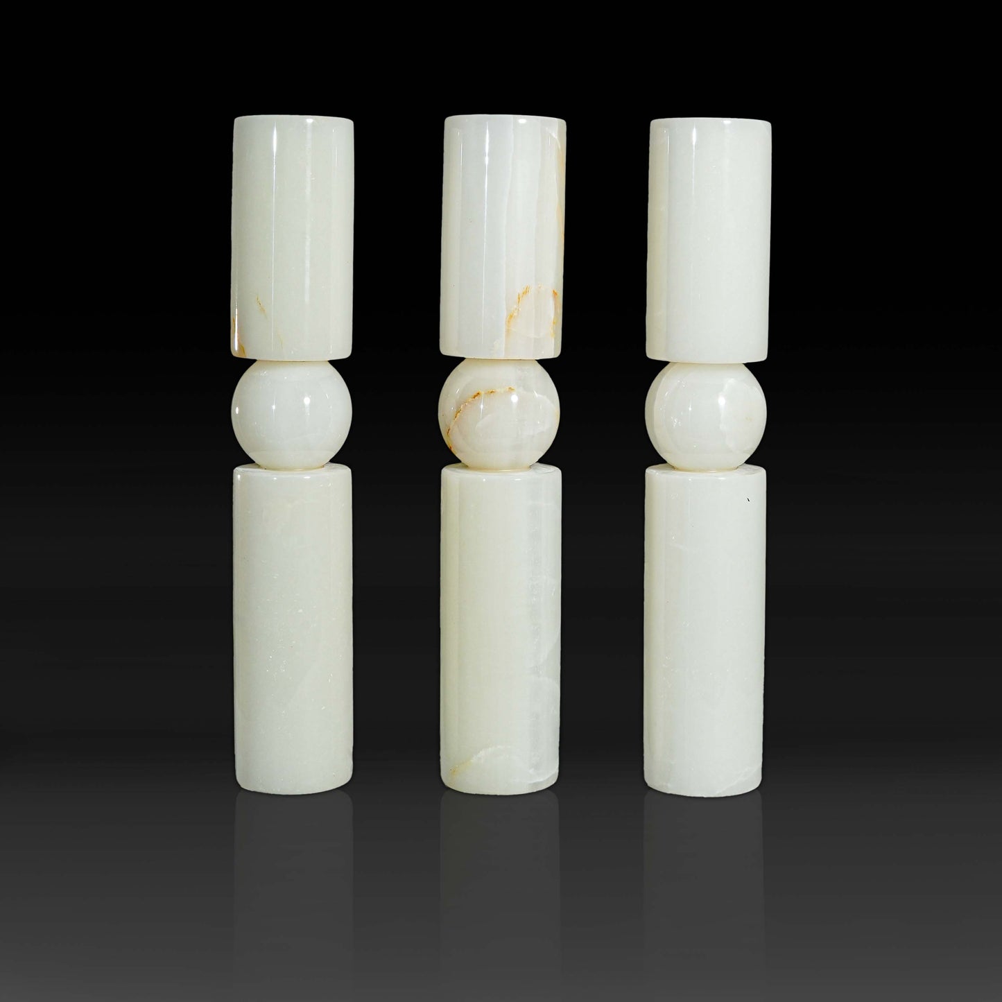 Set of three Solis White Onyx natural stone candle holders showcasing polished white onyx and subtle natural veining.
