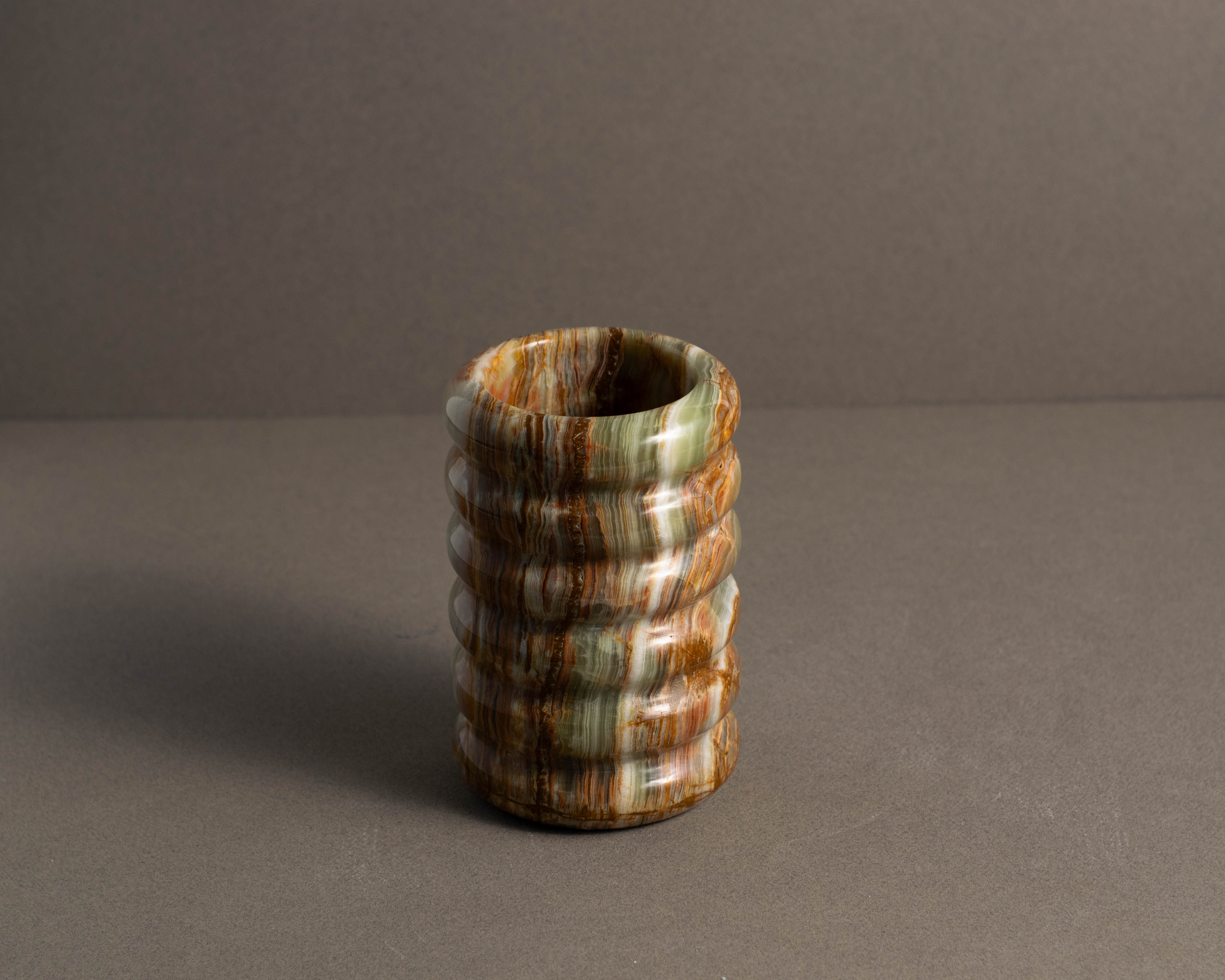 Tidal Green Onyx Vase showing polished natural green onyx veining.
