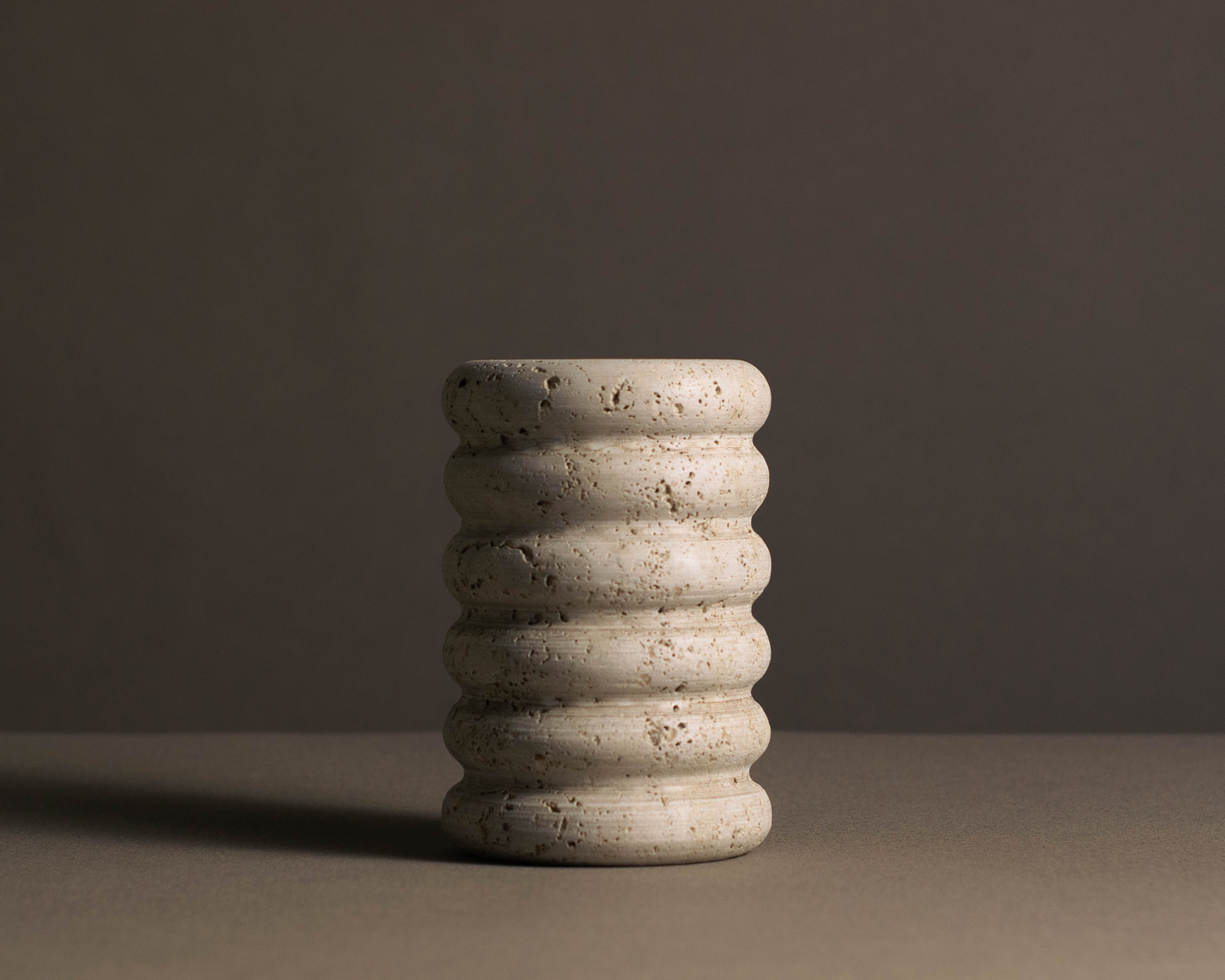 Tidal Travertine Vase handcrafted from solid natural travertine.