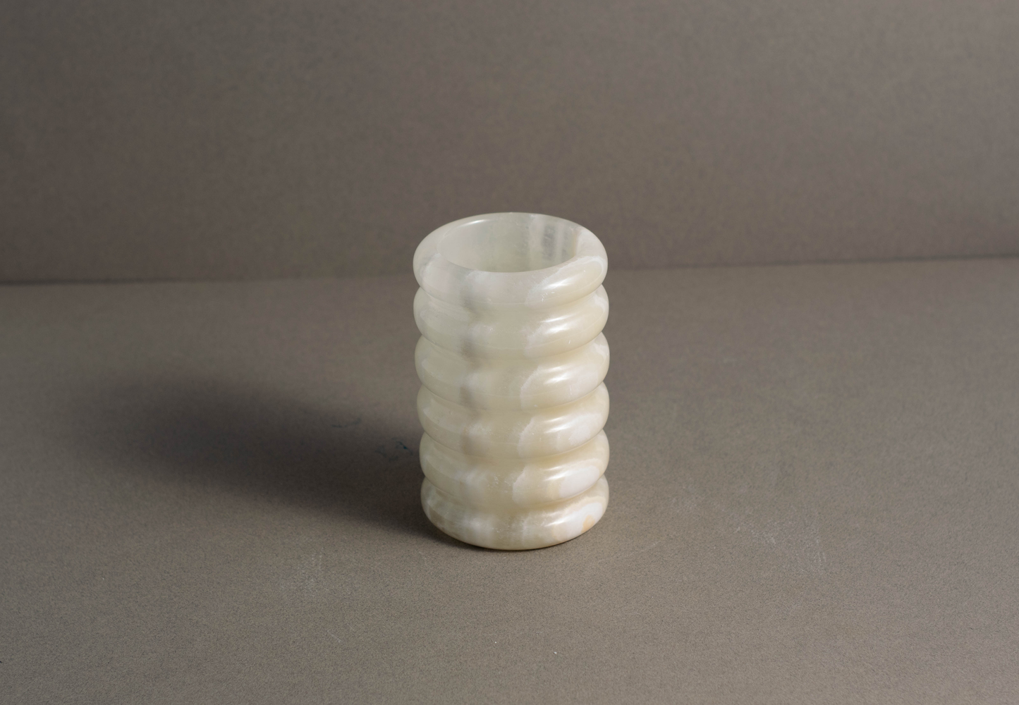 Tidal White Onyx Vase showing natural white onyx veining and polished finish.