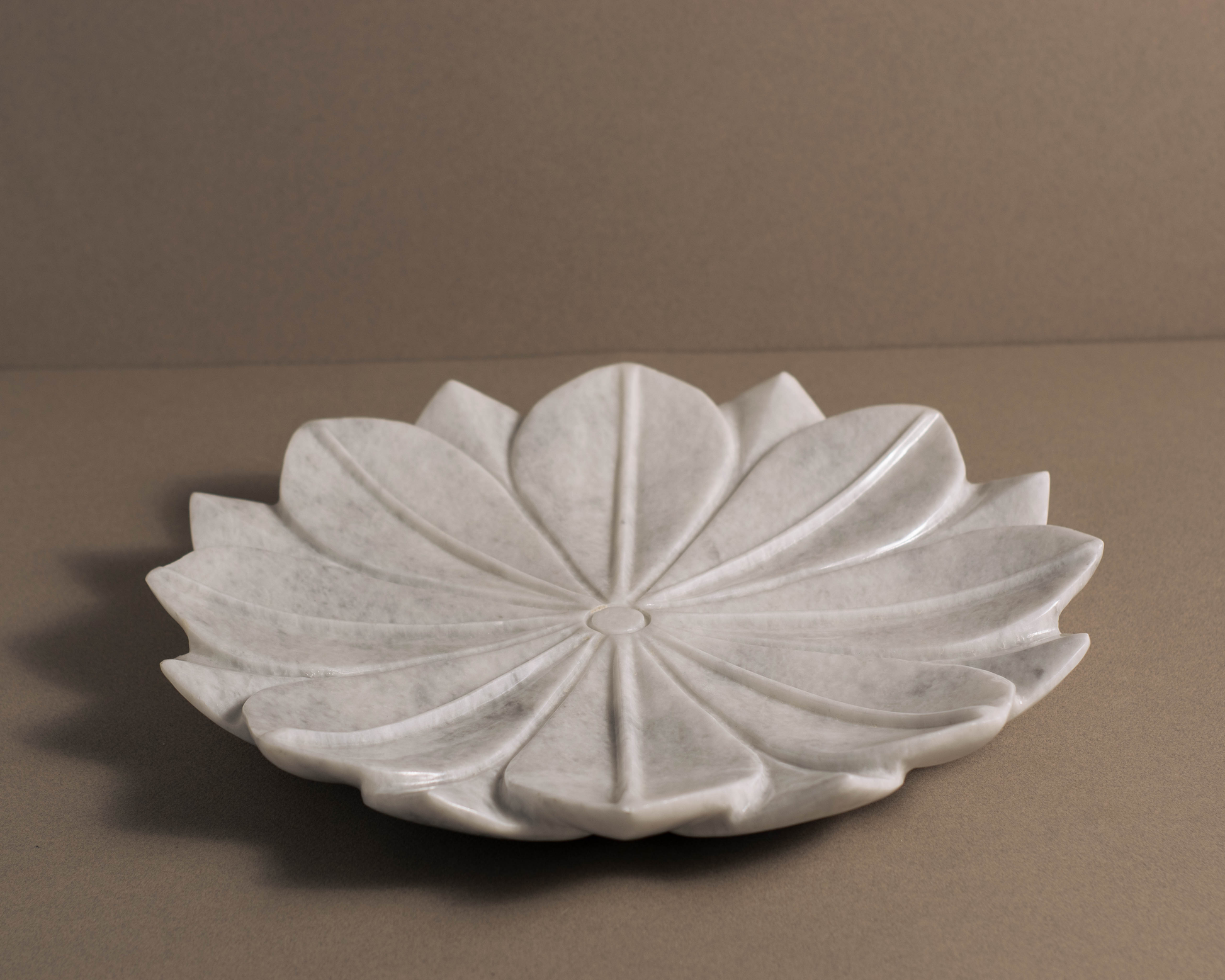 Front angle of the White Marble Lotus Bowl showcasing carved lotus petals.
