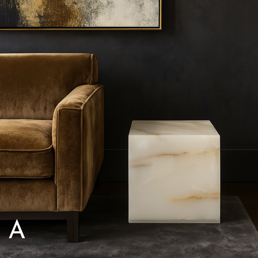 White onyx cube side table variation A styled beside a brown velvet sofa in a refined living room.
