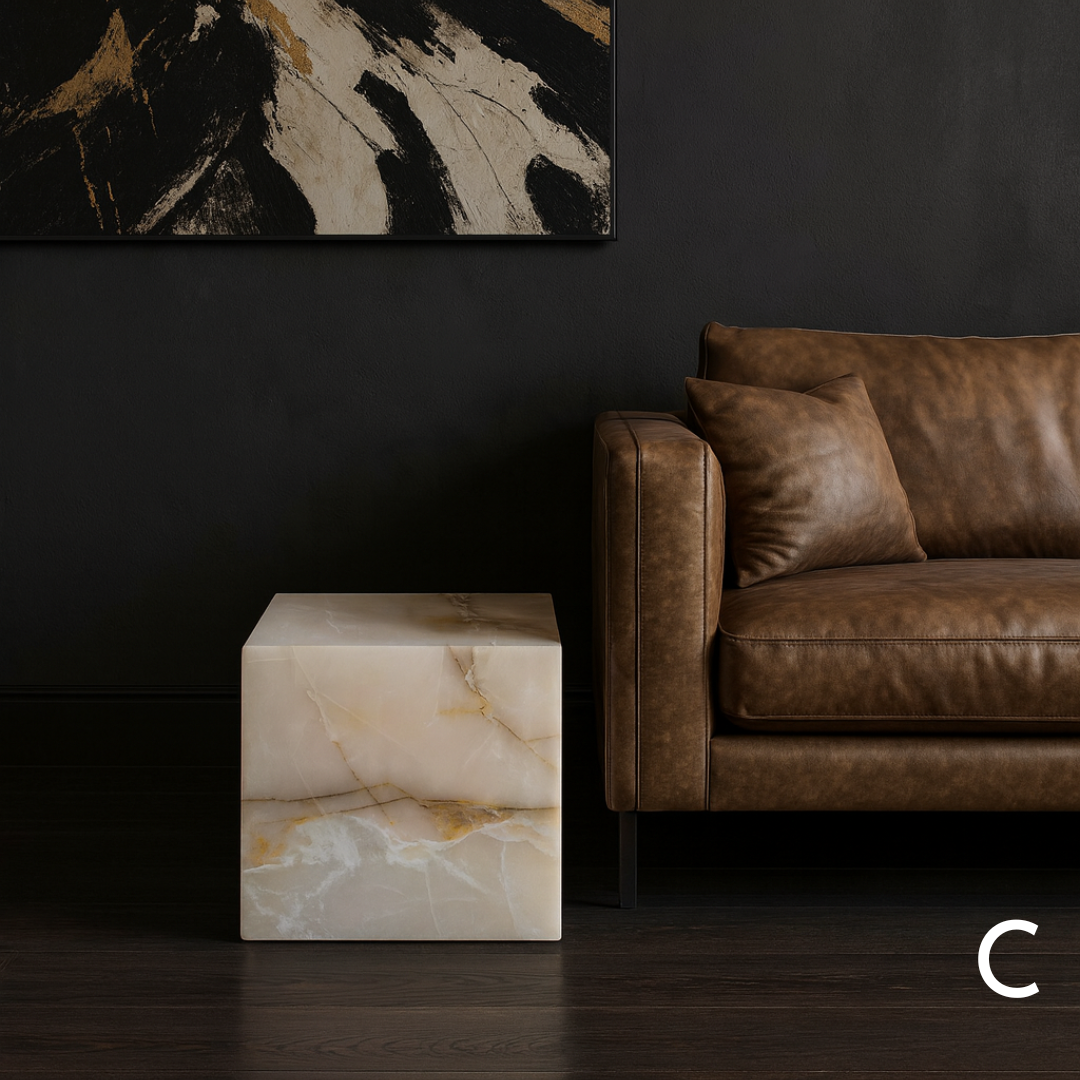 White onyx cube side table variation C styled beside a brown leather sofa in a dark contemporary living room.