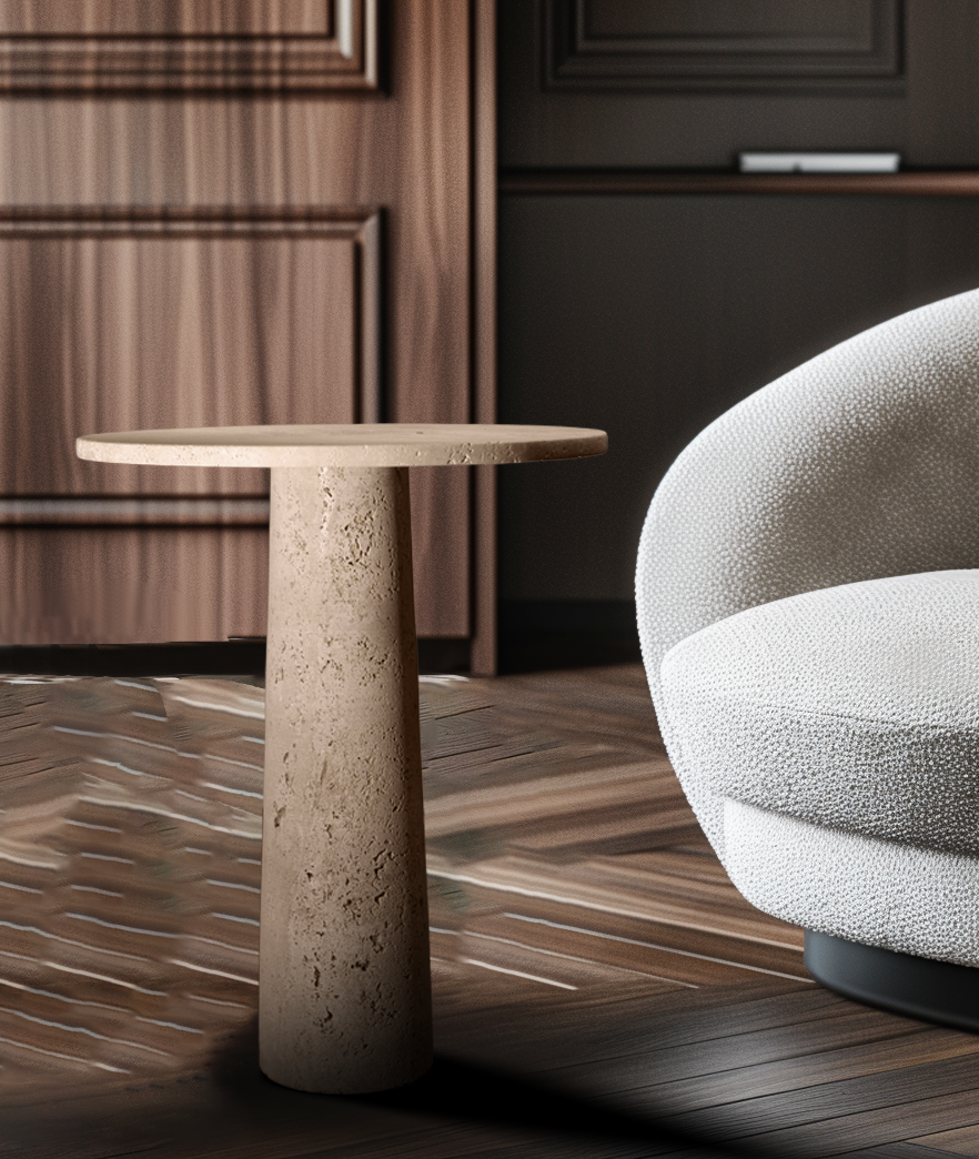 Zenith Travertine Side Table styled beside a lounge chair in a contemporary living room.